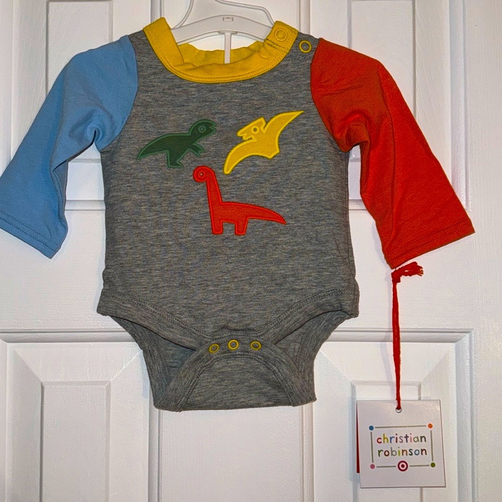Christian Robinson long sleeves onesie with dinosaurs, size NB 6 to 8 1/2 pounds